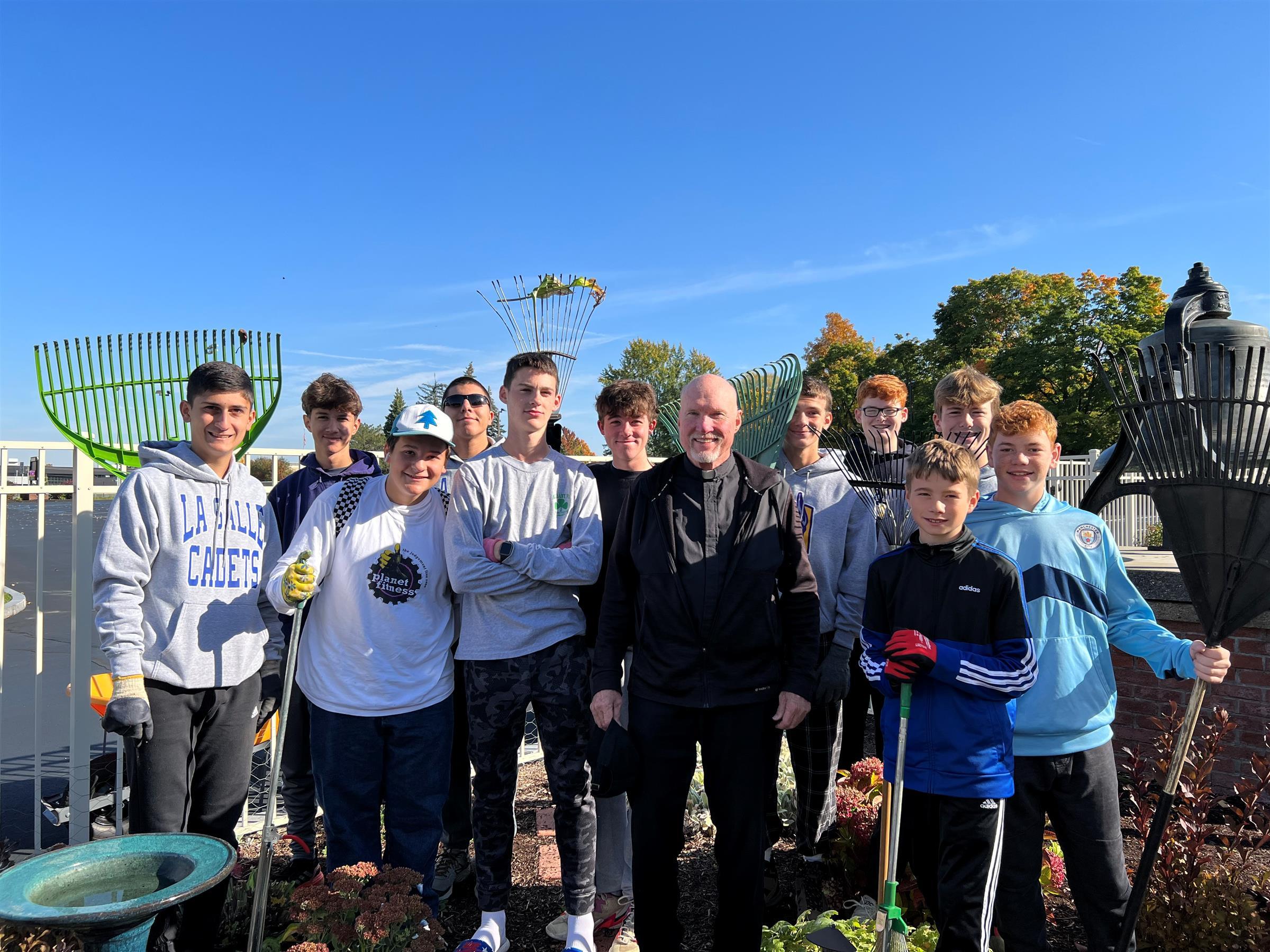 Soccer team cleaning St. Michael's garden