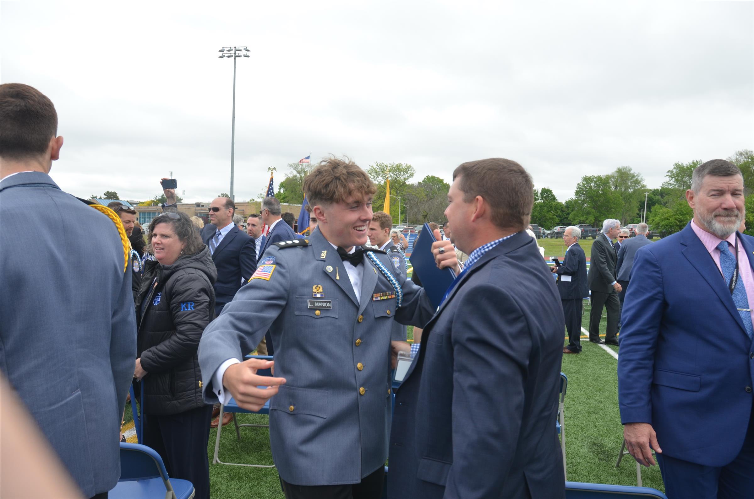 student giving hug on graduation day