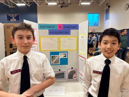 Two students with their science fair project